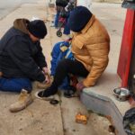 Proving shoes for a homeless man 